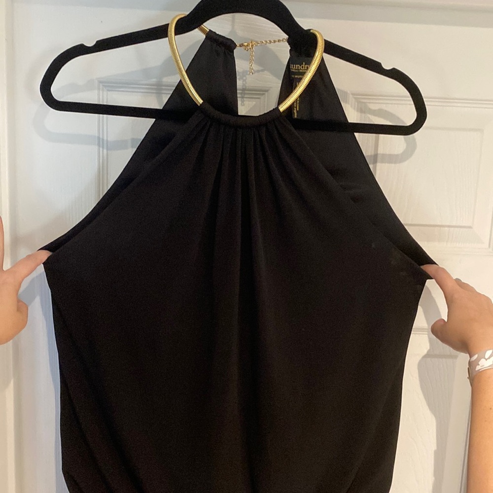 Black halter dress with gold clasp necklace
